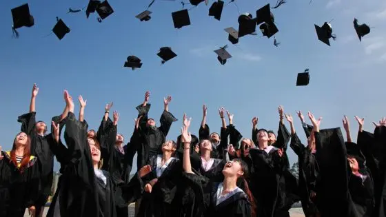 throwing hats in the air at graduation