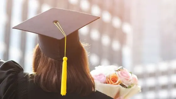 girl graduation back with flowers